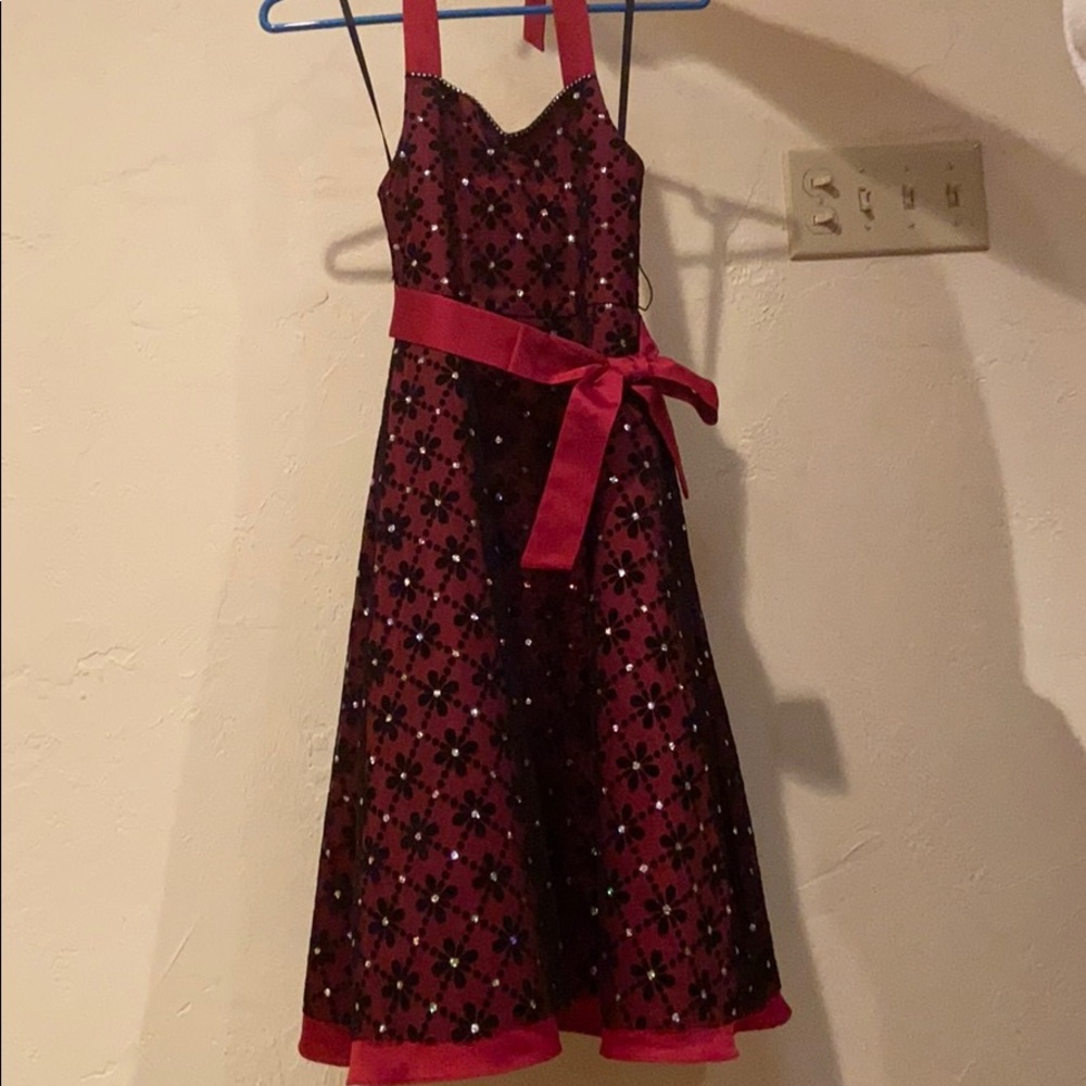 A formal dress with a velvet shrug